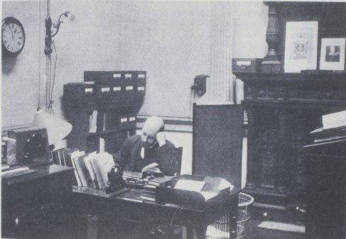 Thomas William Lyster, Librarian 1895-1920, pictured in his office in 1897. He appears under his own name in the episode of Ulysses set in the National Library, "Scylla and Charybdis".